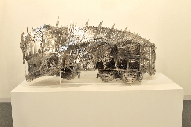 Installation view, Abu Dhabi Art 2014 - Wim Delvoye, Twisted Dump Truck (Clockwise) , 2013, Nickeled bronze, 200 × 83 × 95 cm, DELV0056  